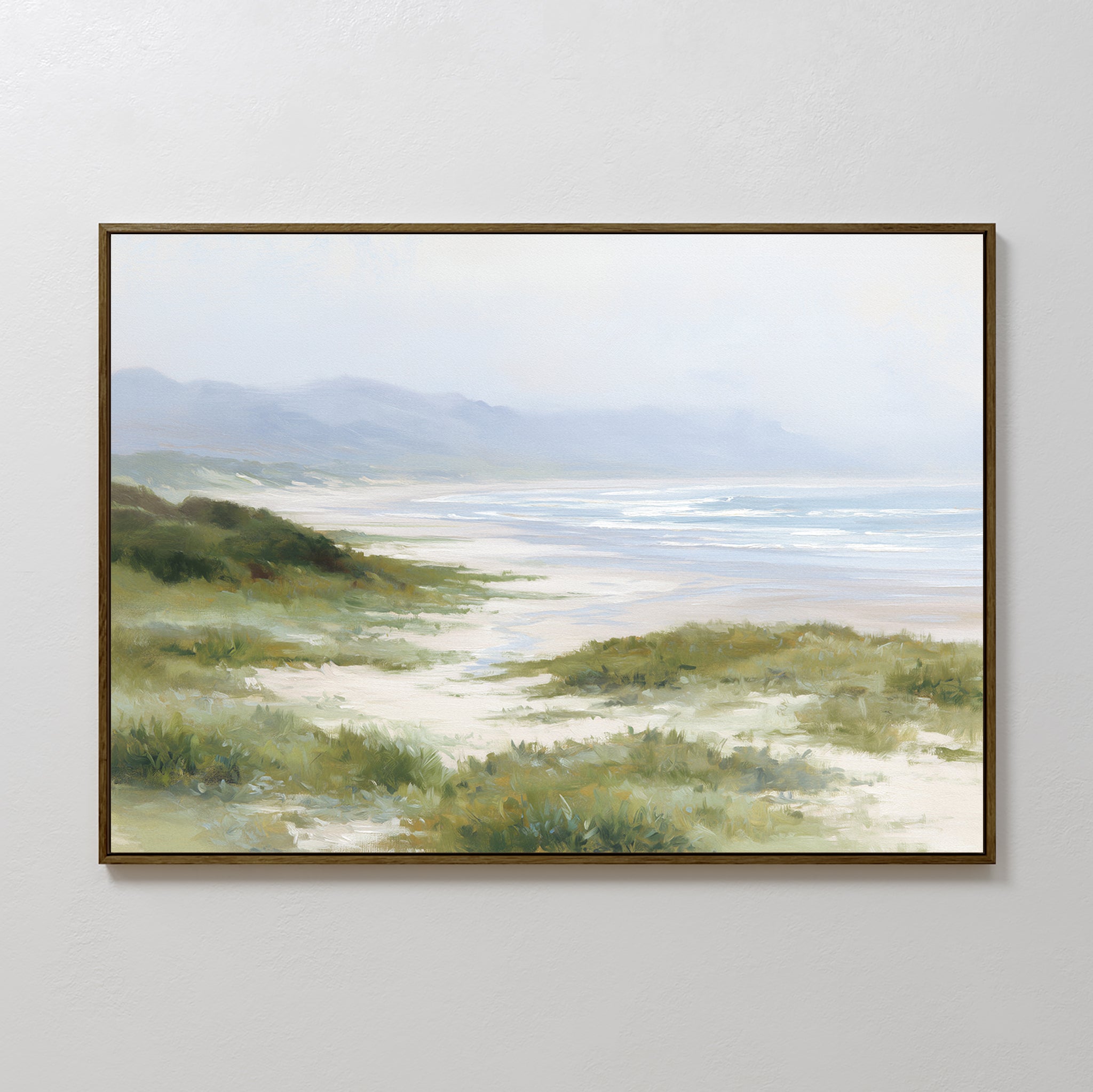 The Windswept Dunes Canvas Art - Horizontal features grassy sand dunes, a sandy shore, gentle waves, and distant hazy mountains beneath a light cloudy sky—ideal for adding a tranquil touch to any space.