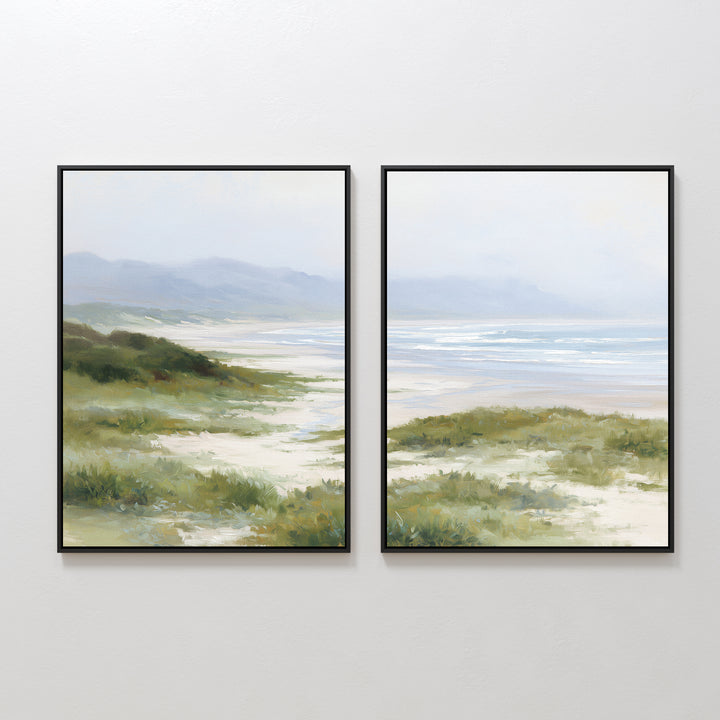 The "Windswept Dunes - Set of 2" features framed canvas prints side by side, showcasing tranquil coastal grasslands and sandy paths under a misty blue sky in soft, muted tones for a calming effect.