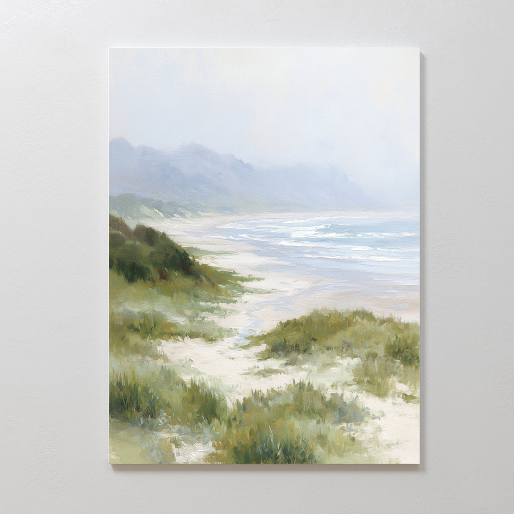 The Windswept Dunes Canvas Art - Vertical features a soft, pastel beach scene with gentle waves, grassy dunes, and hazy mountains—ideal as calming decor or coastal wall art for any serene space.