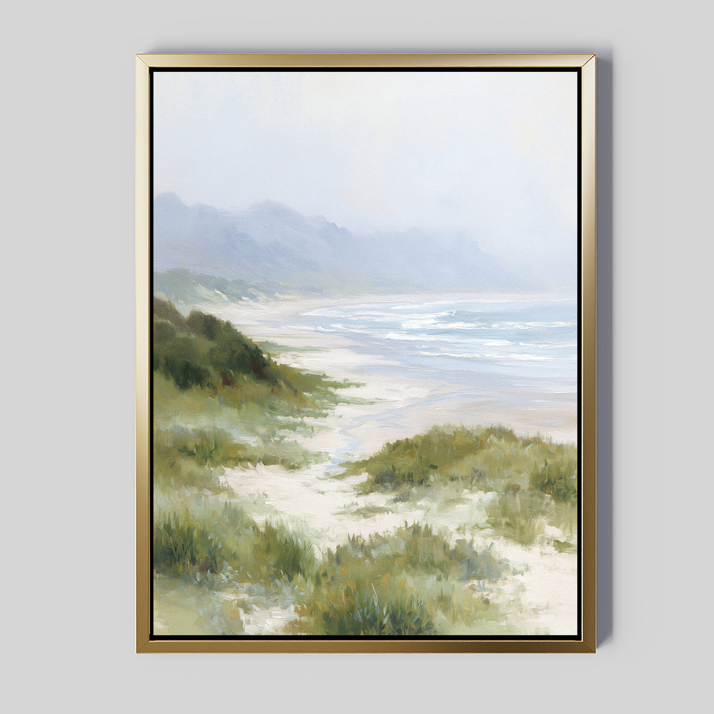 Windswept Dunes Canvas Art - Vertical features a tranquil beach with grassy dunes, soft waves, and misty mountains beneath a cloudy sky—an ideal calming accent for any room.