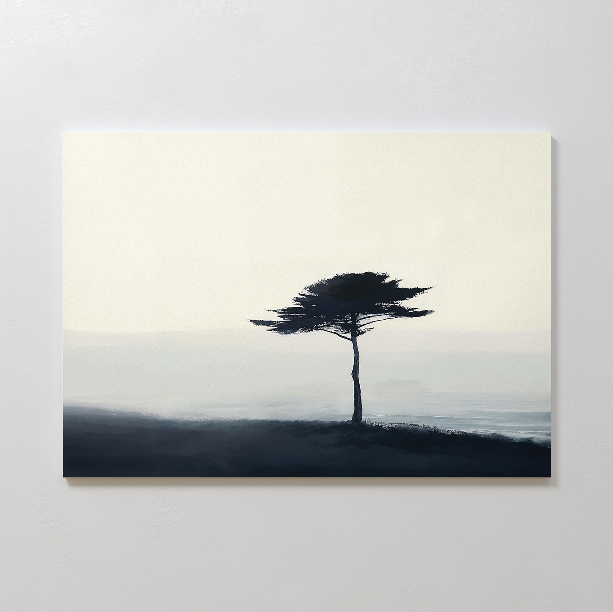 The Windswept Solitude Canvas Art - Horizontal features a minimalist painting of a lone tree with a broad canopy on a misty hill, set against a soft sky—ideal as serene, modern wall art for your living room.