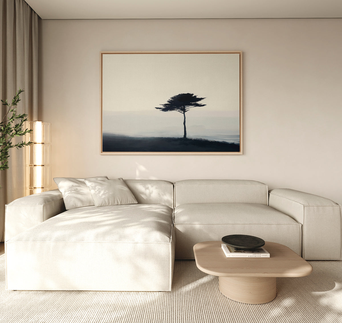 Minimalist living room with a light beige sectional, wooden coffee table with black bowl, neutral walls, tall beige curtains, potted plant in the corner, and Windswept Solitude Canvas Art - Horizontal as large framed wall décor.