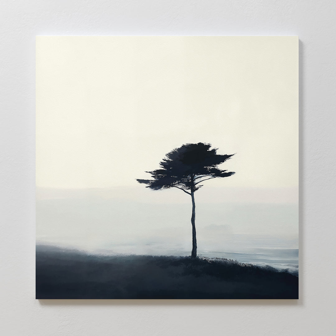 Windswept Solitude Canvas Art - Square features a lone tree with sparse branches on a misty hilltop in soft blues and grays, creating moody minimalist wall art ideal for enhancing modern living room decor.