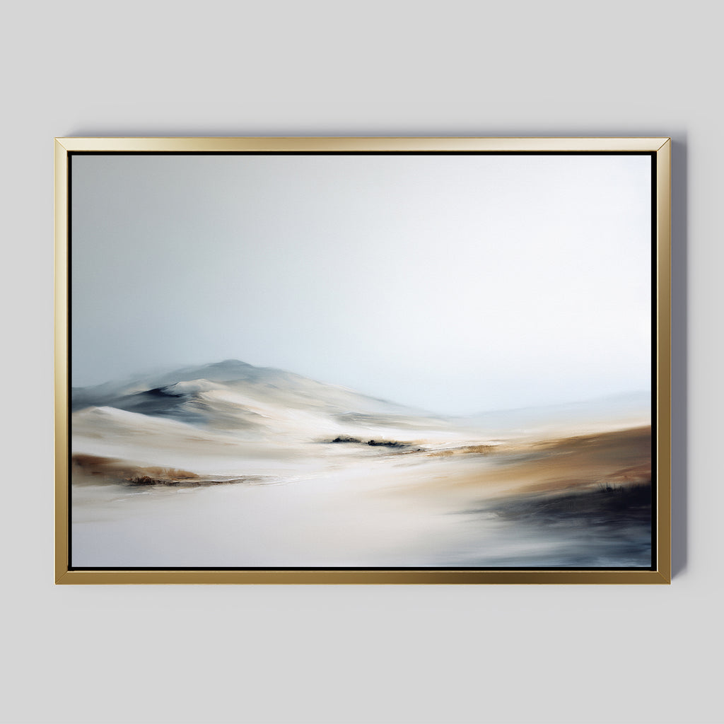 The Winter Plains Canvas Art - Horizontal features an abstract, misty landscape in gentle beige, white, and gray tones, evoking calm with its smooth, blurred style reminiscent of sand dunes or snowy plains beneath a pale sky. Framed and serene.