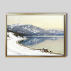 Winter Reflection Canvas Art - Horizontal showcases a tranquil snowy lakeshore with clear water, pine trees, and snow-capped mountains—a serene winter landscape print ideal for alpine lake wall art decor in any room.