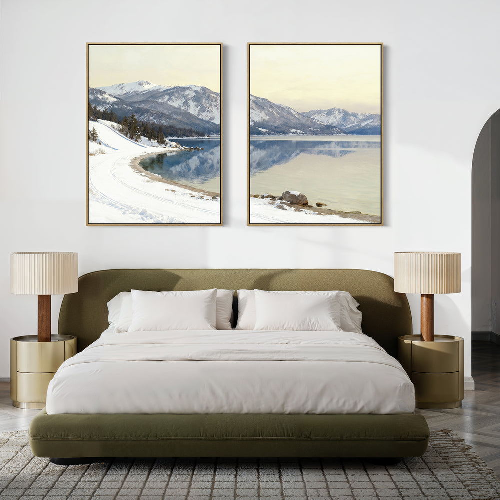 A modern bedroom featuring a green upholstered bed with white bedding, two beige nightstands with matching lamps, and the "Winter Reflection - Set of 2" artwork depicting snowy mountains and a lake above the bed.