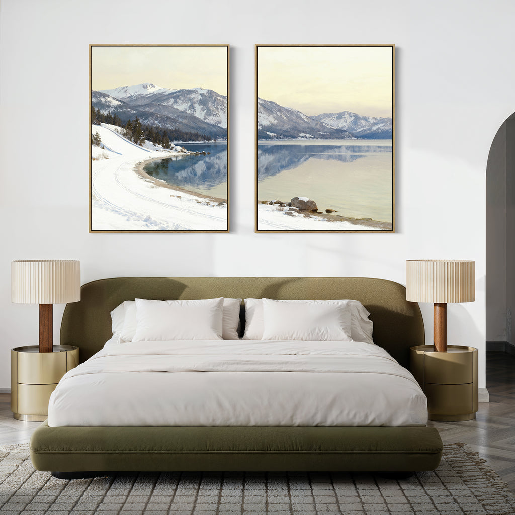A modern bedroom featuring a green upholstered bed with white bedding, two beige nightstands with matching lamps, and the "Winter Reflection - Set of 2" artwork depicting snowy mountains and a lake above the bed.