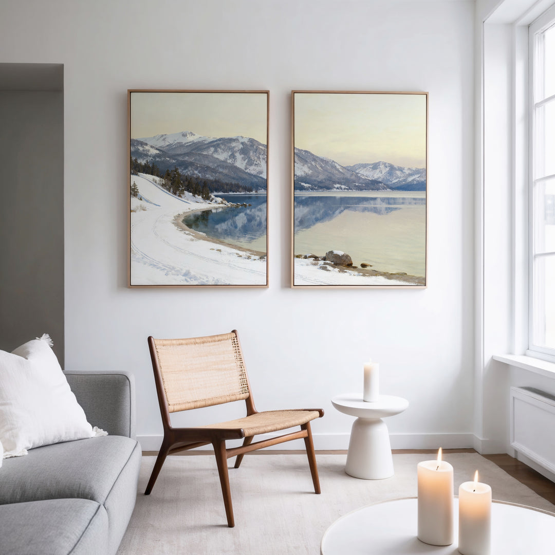 A living room with a couch and chair is beautifully accented by the Winter Reflection - Set of 2 wall art, bringing serene alpine lake beauty to the space.