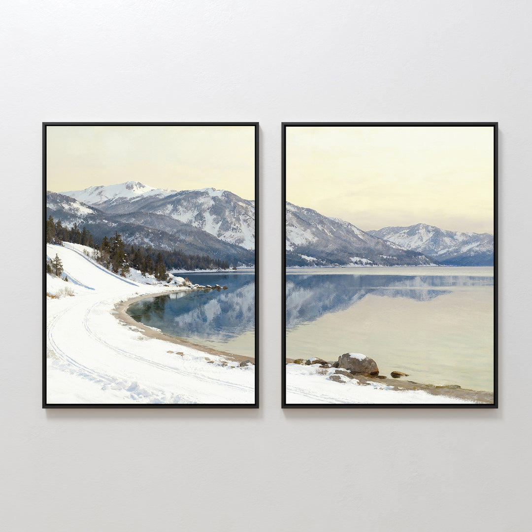 The Winter Reflection - Set of 2 features framed prints of a snowy alpine lake with mountains mirrored in calm water beneath a pale sky, creating a serene winter scene when displayed side by side on any wall.