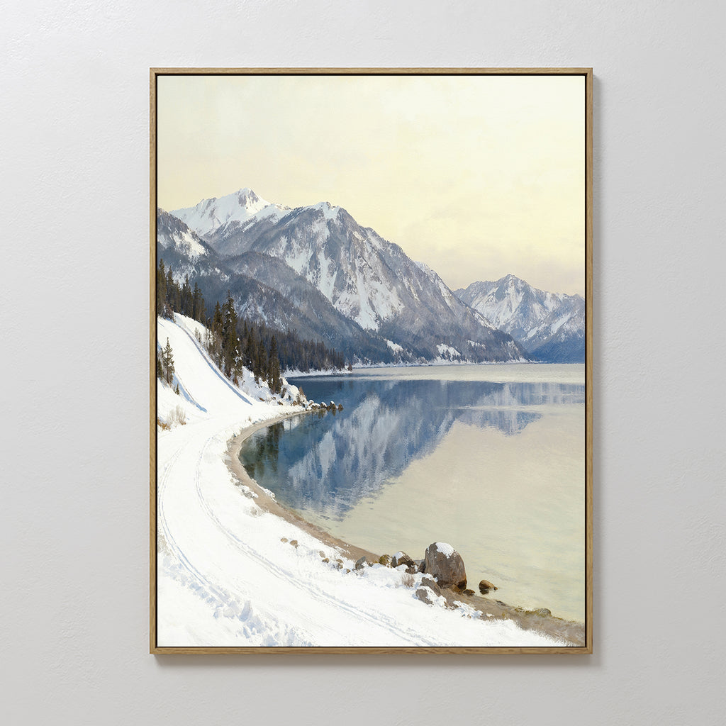 The Winter Reflection Canvas Art - Vertical features a serene winter landscape with snowy mountains, a calm alpine lake, and a snow-covered path, making it perfect for Nordic Park-inspired wall art.