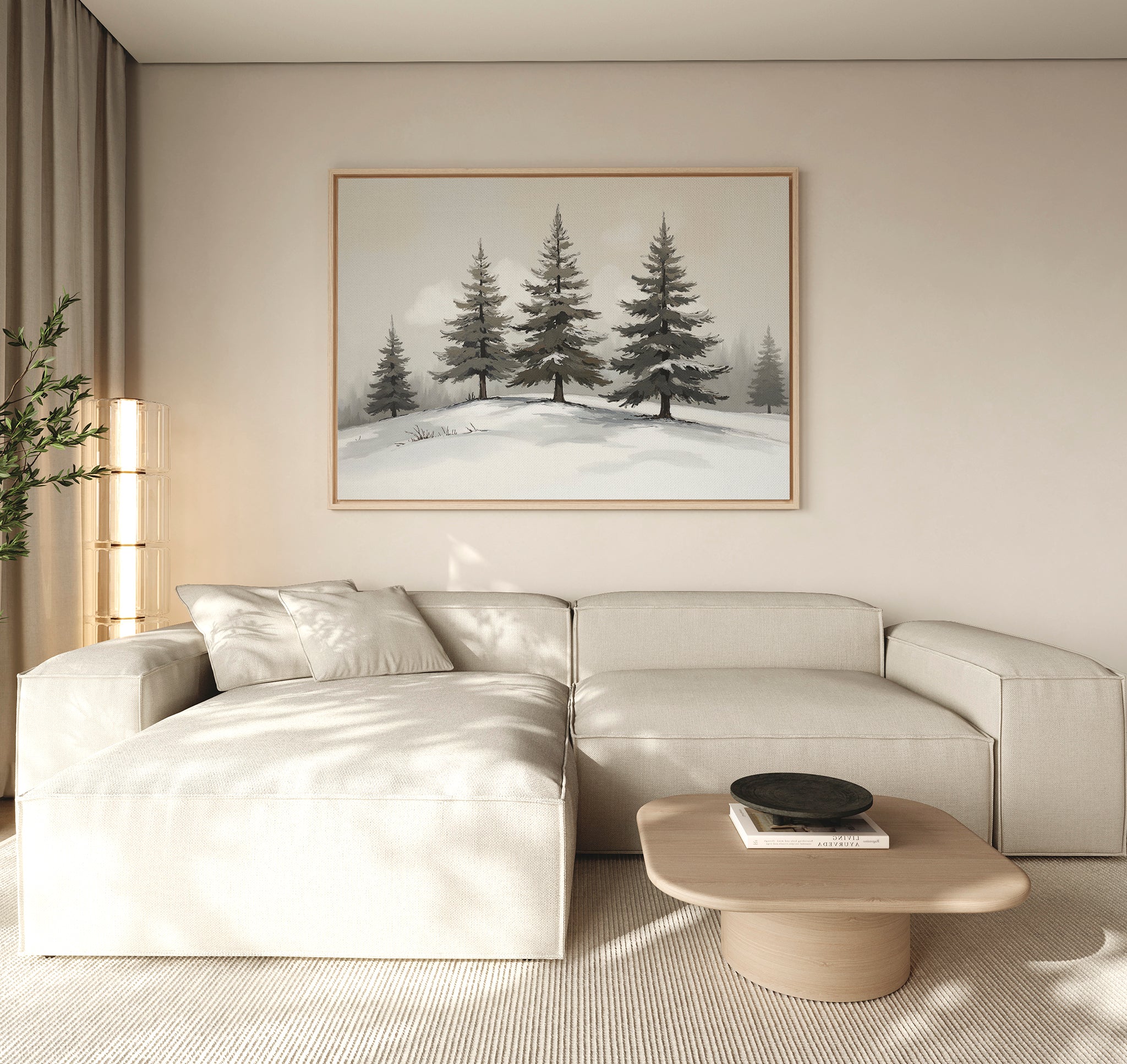 A minimalist living room with a beige sectional, light wood coffee table, and potted plant features the Winter Solitude Canvas Art - Horizontal. Natural light fills the space, evoking calm reminiscent of tranquil bedroom decor.