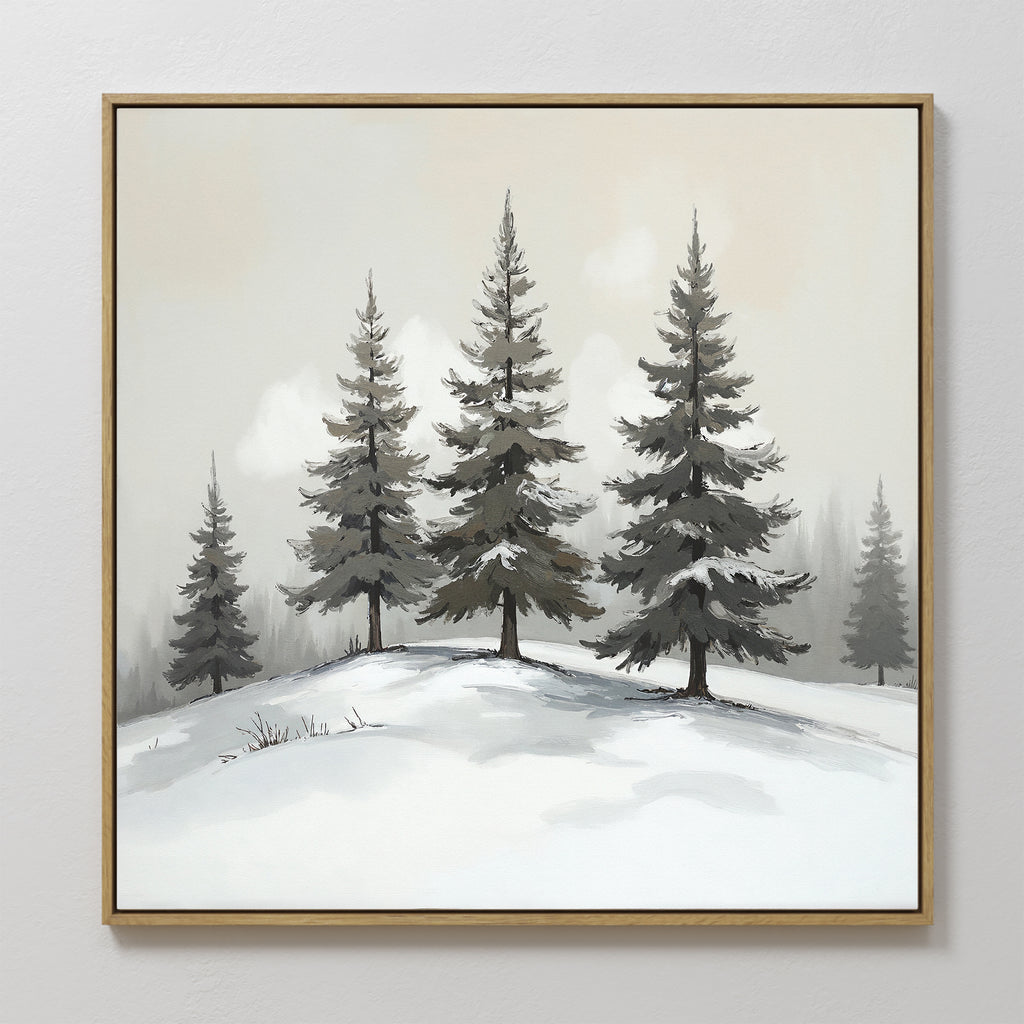 The Winter Solitude Canvas Art - Square features evergreen trees on a snowy hill under a foggy sky. Muted tones and soft shadows create a calming winter scene, making it ideal monochromatic wall art for your home.